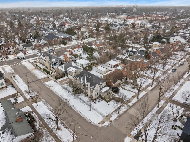 snowy aerial view featuring a residential view