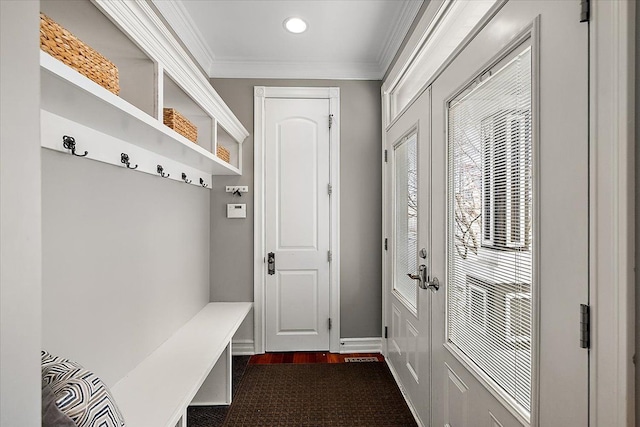 mudroom with ornamental molding, dark wood finished floors, and baseboards