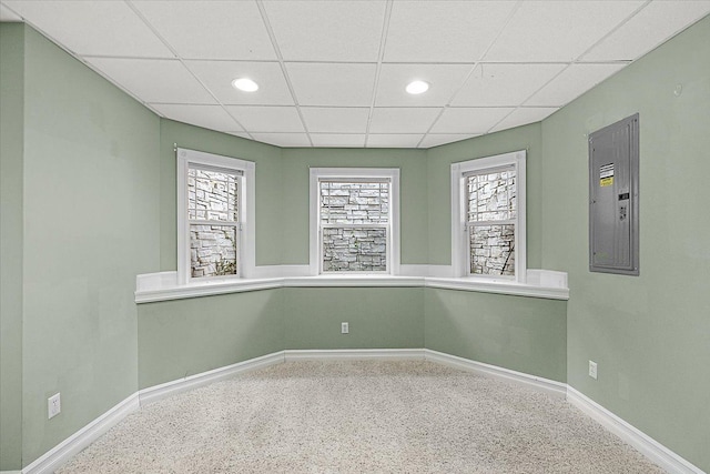 unfurnished room featuring recessed lighting, a paneled ceiling, and baseboards