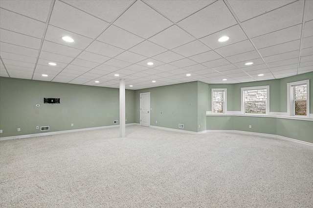 basement with recessed lighting, visible vents, a paneled ceiling, and baseboards