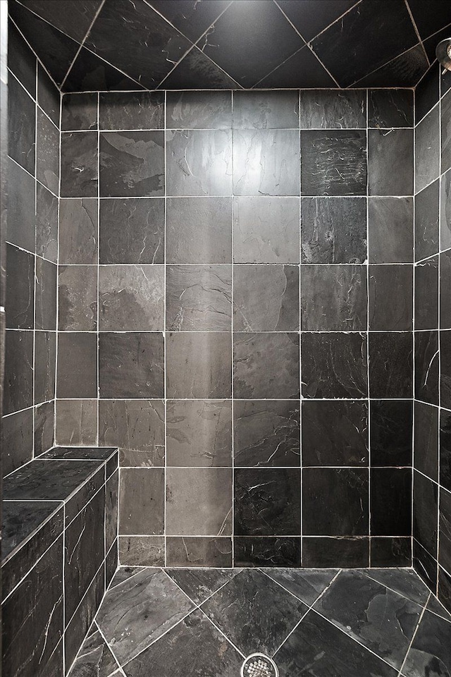 full bathroom with a tile shower