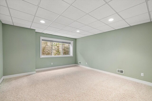 carpeted empty room with recessed lighting, visible vents, and baseboards