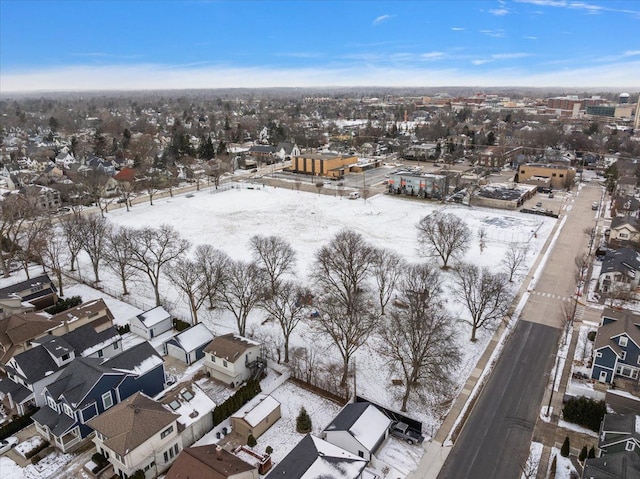 snowy aerial view featuring a residential view