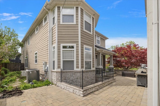 1419 Henrietta St, Birmingham, MI 48009 - exterior space featuring fence, central AC unit, and a patio area
