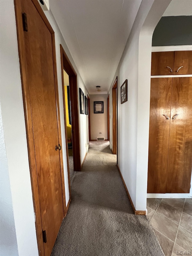 corridor with carpet floors