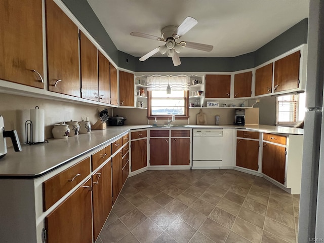 kitchen with white dishwasher, sink, and ceiling fan