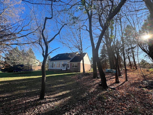 119 Prestwick Trl, Highland, MI 48357 - exterior space with a trampoline