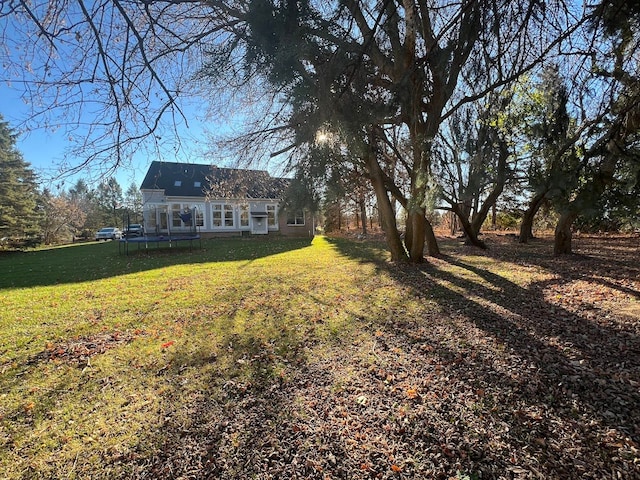 view of yard with a trampoline