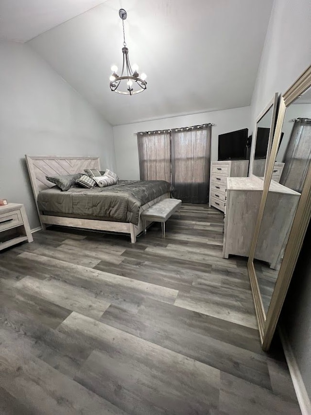 bedroom with lofted ceiling, dark wood-type flooring, and an inviting chandelier