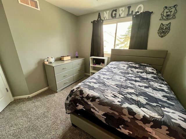 bedroom featuring baseboards, visible vents, and carpet flooring