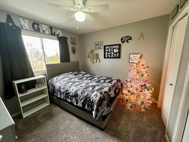 bedroom featuring dark carpet and a ceiling fan