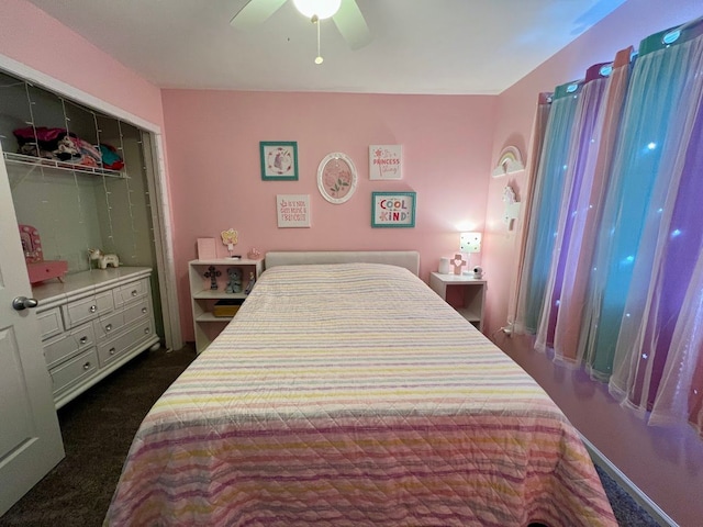 bedroom featuring ceiling fan and a closet