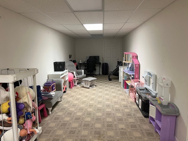 game room featuring carpet floors and a drop ceiling