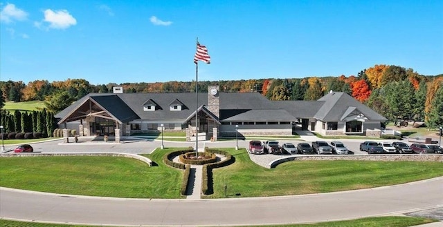 view of home's community featuring a lawn