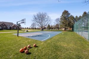 119 Prestwick Trl, Highland, MI 48357 - view of sport court with a lawn, fence, and community basketball court