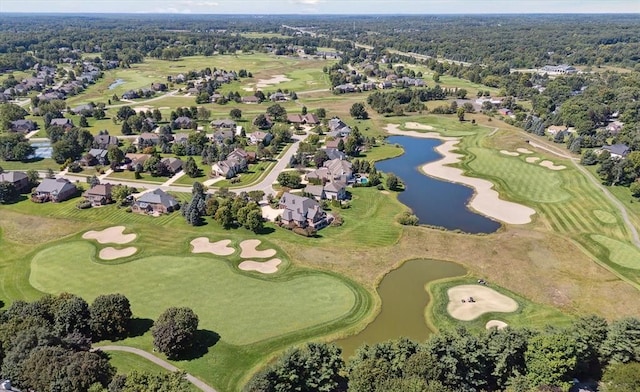 aerial view featuring a water view and golf course view