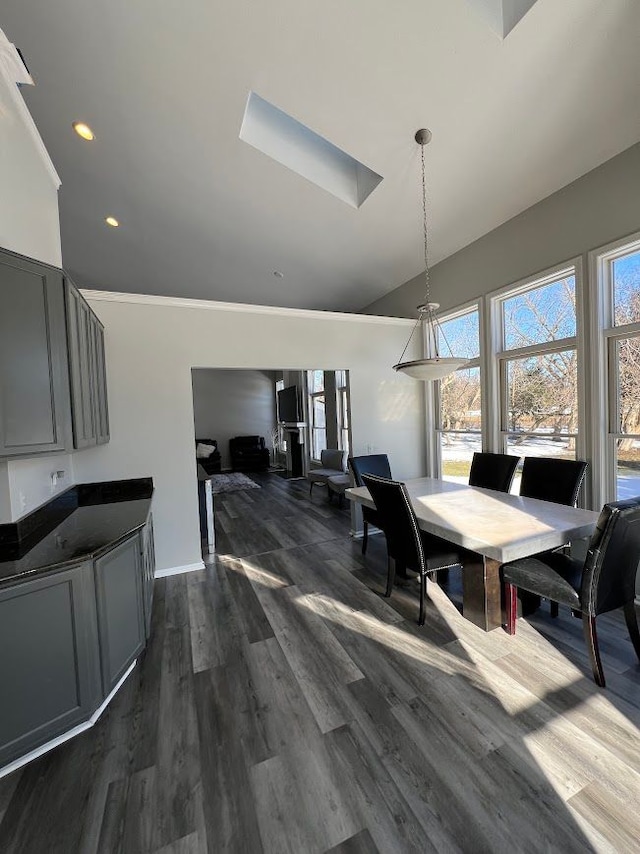 dining space featuring dark wood finished floors and recessed lighting