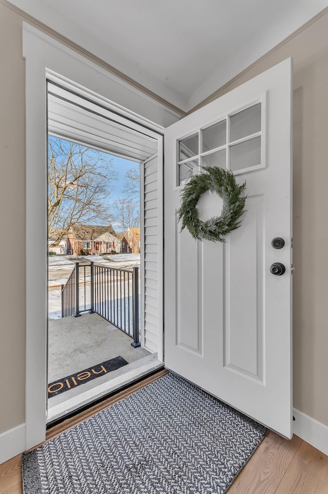 entryway with wood-type flooring