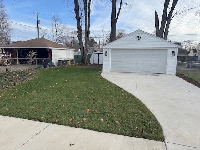 garage featuring central AC and a yard