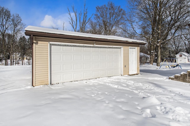 view of snow covered garage