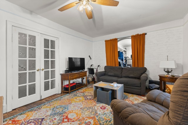 living room with ceiling fan, french doors, and hardwood / wood-style flooring