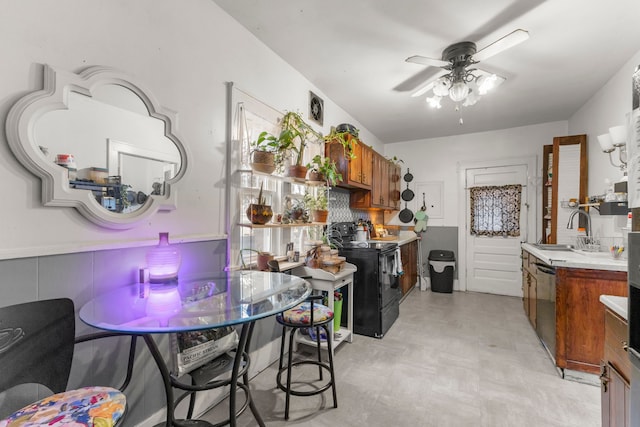 kitchen with ceiling fan, sink, dishwasher, and black electric range