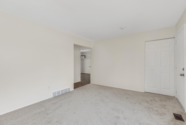 empty room featuring carpet floors