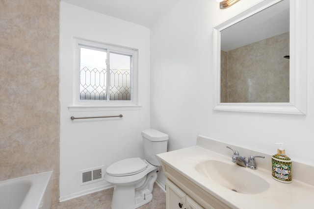 bathroom featuring toilet and vanity