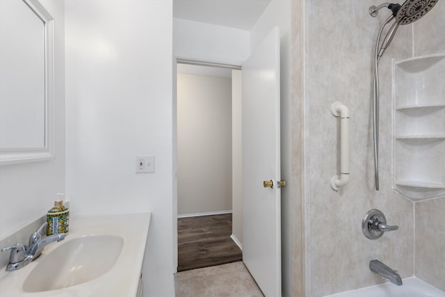 bathroom featuring vanity, washtub / shower combination, and tile patterned floors