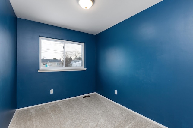 spare room featuring carpet flooring