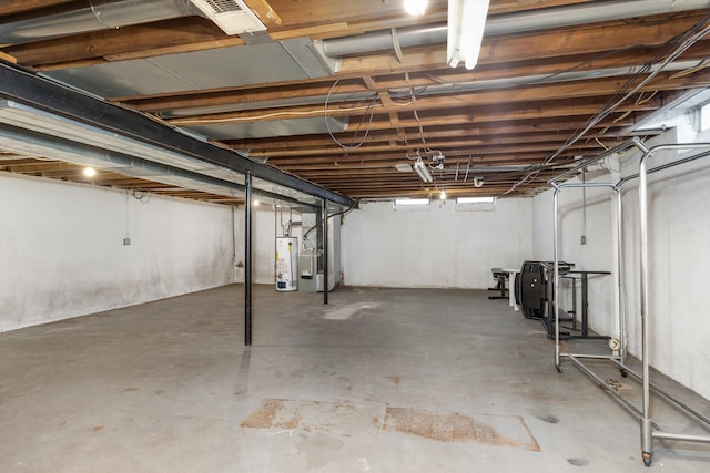 basement featuring heating unit and gas water heater