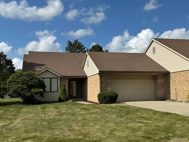 ranch-style house with a garage and a front yard