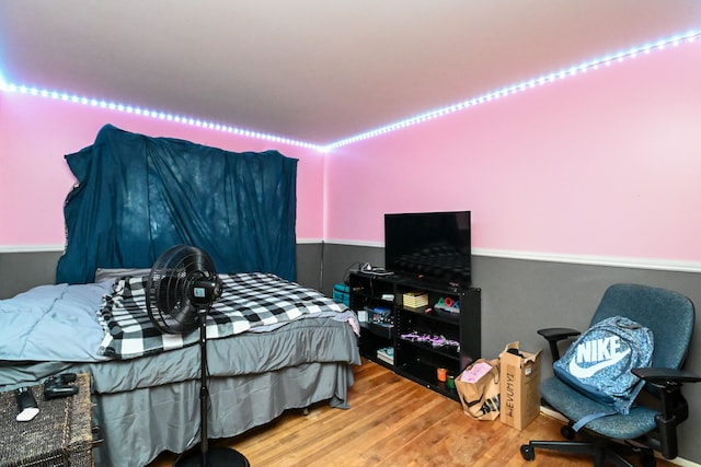 bedroom with hardwood / wood-style floors