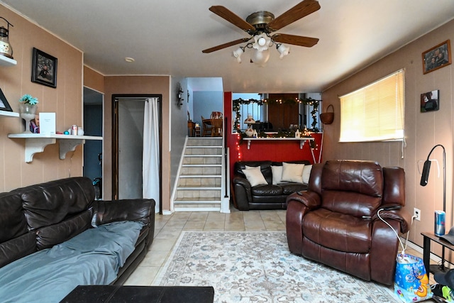 living room featuring light tile patterned flooring and ceiling fan