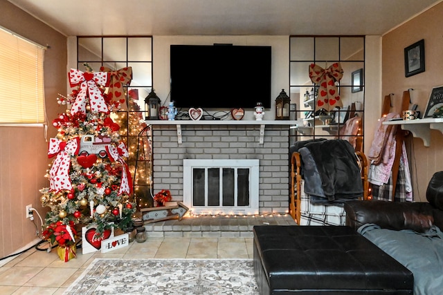 tiled living room with a brick fireplace