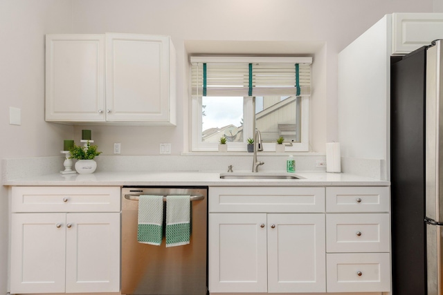 kitchen featuring sink, white cabinetry, and stainless steel appliances