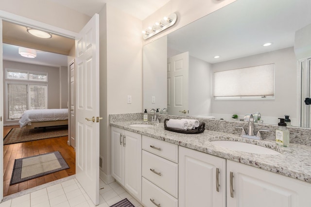 bathroom featuring hardwood / wood-style floors and vanity