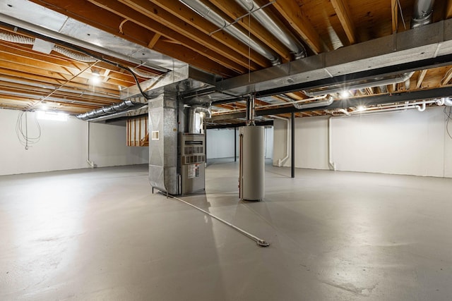 basement featuring gas water heater and heating unit