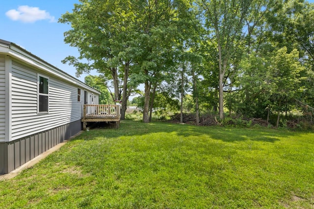 view of yard with a wooden deck