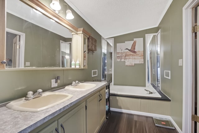 bathroom featuring lofted ceiling, a textured ceiling, vanity, a bath, and hardwood / wood-style flooring