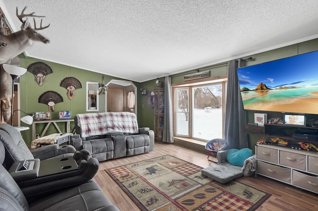 living room with ornamental molding and hardwood / wood-style floors