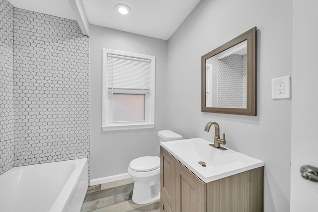 bathroom featuring toilet and vanity