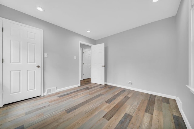 unfurnished bedroom featuring light wood-type flooring