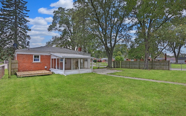 view of yard with a sunroom