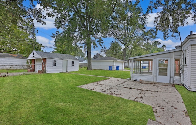 view of yard with an outbuilding and a patio