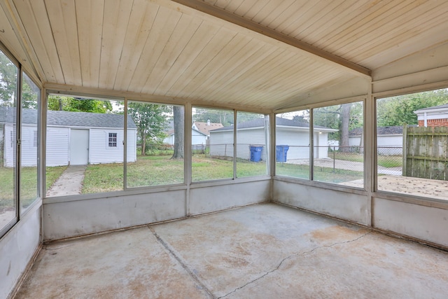 unfurnished sunroom with lofted ceiling and a healthy amount of sunlight