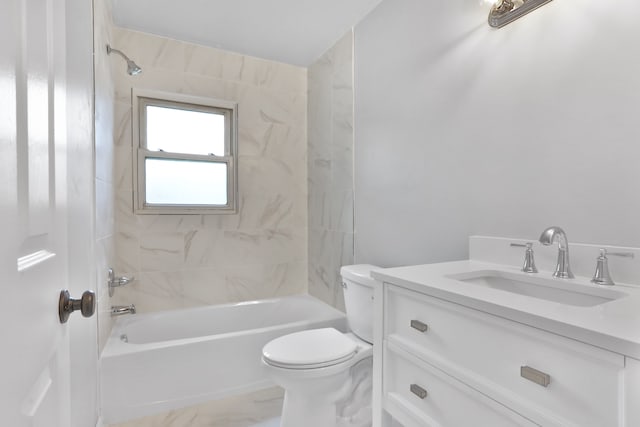 full bathroom with toilet, tiled shower / bath, and vanity