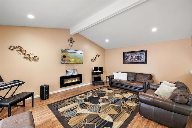 living room featuring lofted ceiling with beams and light wood-type flooring