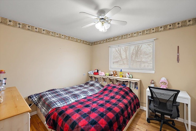 bedroom featuring hardwood / wood-style flooring and ceiling fan