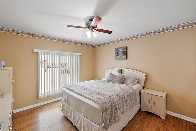 bedroom featuring hardwood / wood-style floors and ceiling fan